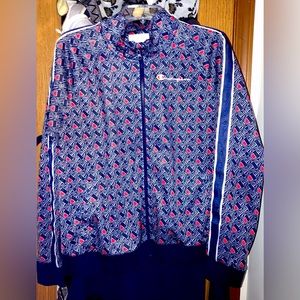 Women’s XL Champion track suit. It’s blue with champion logo all over.